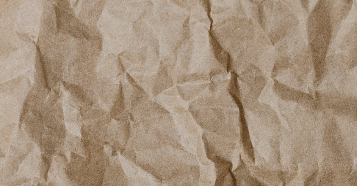 Close-up of crumpled brown paper texture ideal for backgrounds and design projects.